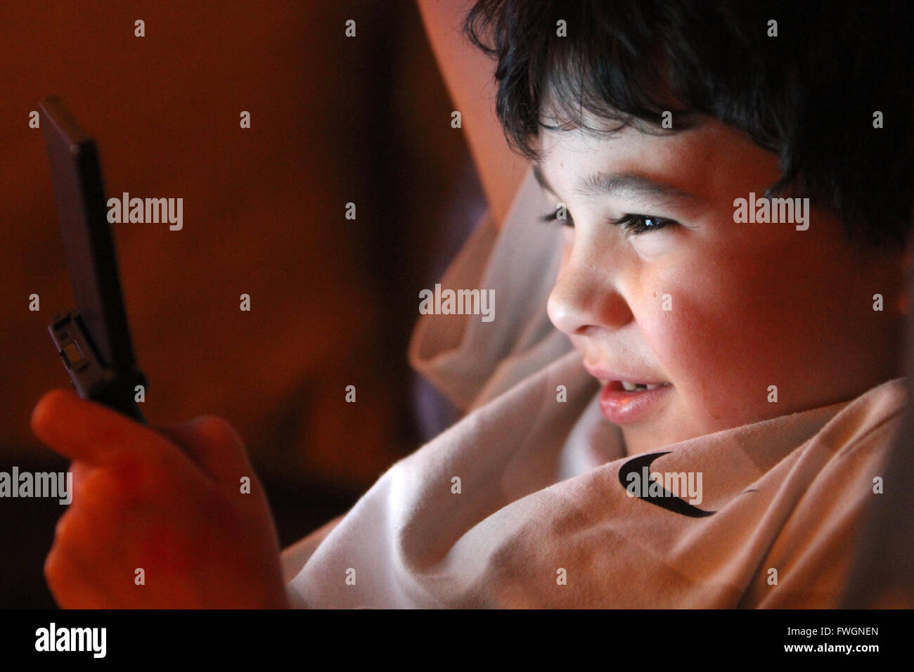 Young boy playing computer console Stock Photo