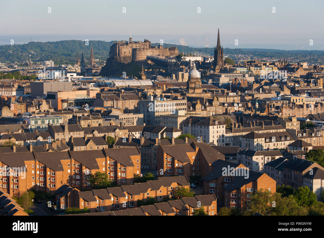 View from Holyrood Park over city rooftops to Edinburgh Castle, Edinburgh, City of Edinburgh, Scotland, United Kingdom, Europe Stock Photo