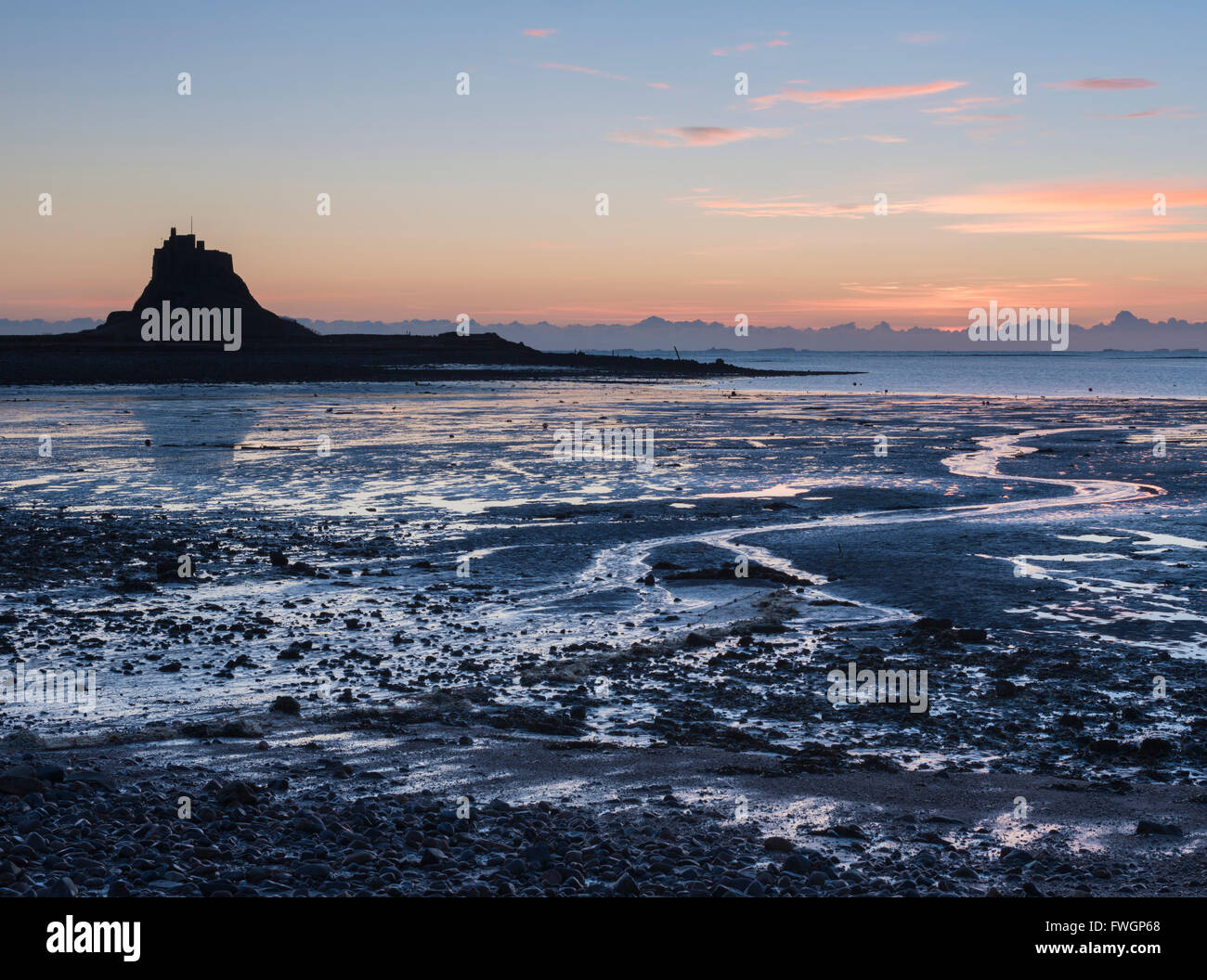 A view across the Ouse to Lindisfarne Castle, Holy Island, Northumberland, England, United Kingdom, Europe Stock Photo