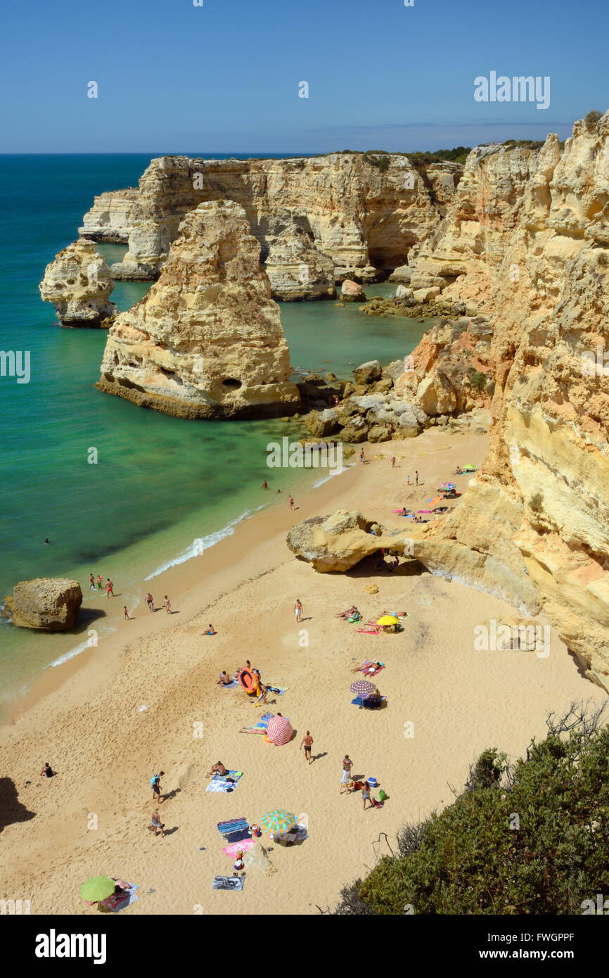 Overview of tourists on beach, sandstone cliffs and seastacks at Praia da Marinha, near Carvoeiro, Algarve, Portugal, Europe Stock Photo