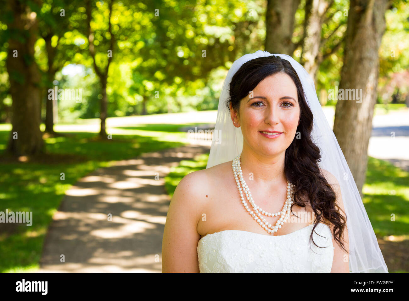 a bride poses for some portraits while wearing her wedding dress at FWGPPY