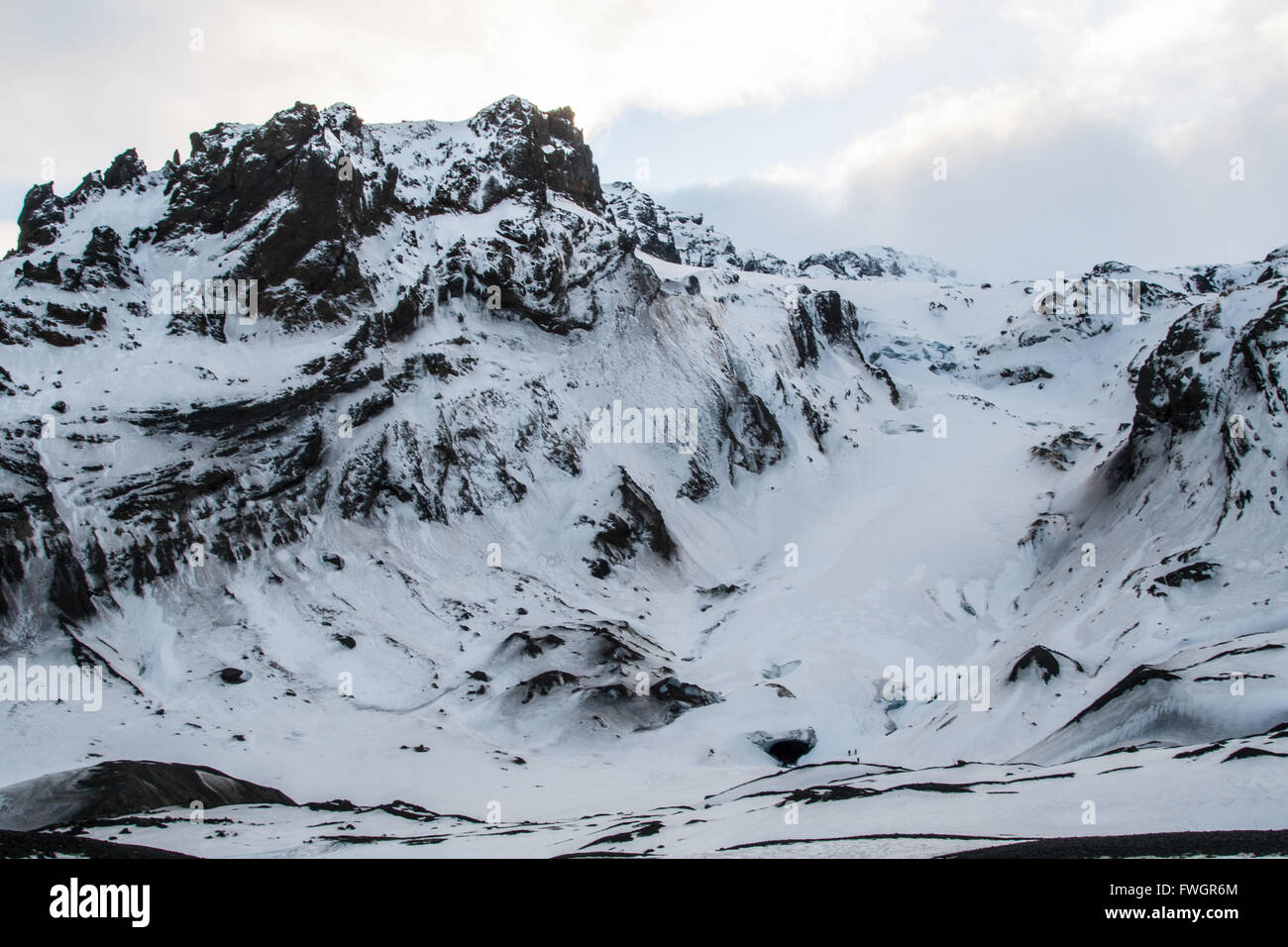 Finger glacier covered in snow, surrounded by mountains, Eyjafjallajokull volcano, Thorsmork, Iceland Stock Photo