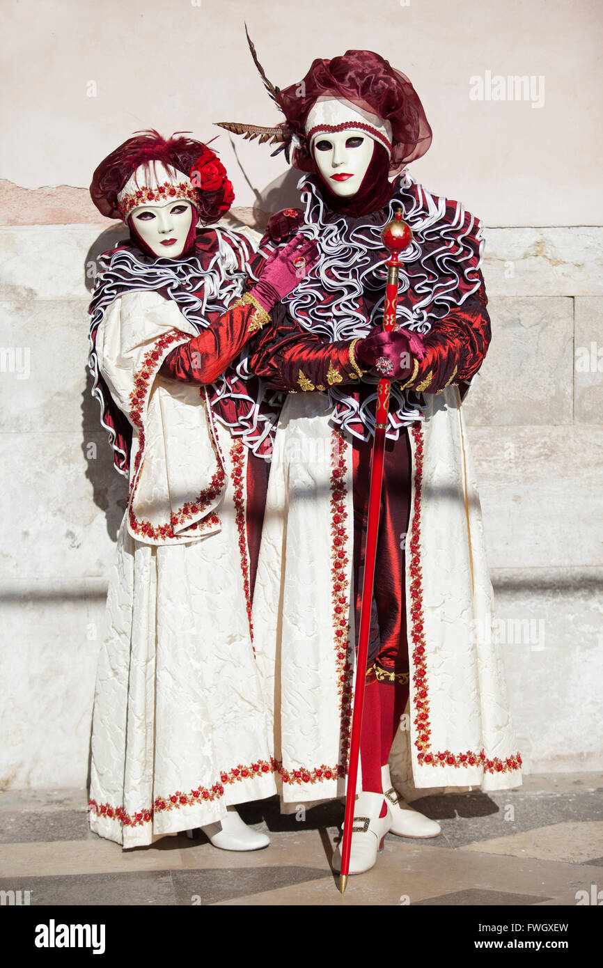 Masks at the Venice Carnival in Saint Mark's Square, Venice, Veneto, Italy. Stock Photo