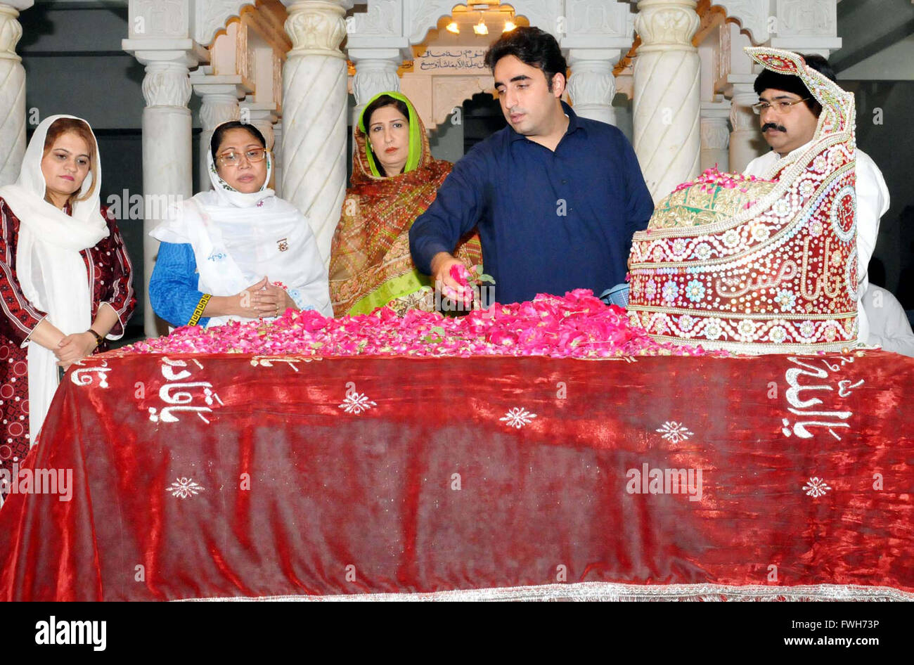 Peoples Party (PPP) Chairman, Bilawal Bhutto Zardari and MNA Faryal Talpur along with other lay floral weather at the grave of Peoples Party (PPP) Founder, Zulfiqar Ali Bhutto, during their visit at his shrine in Garhi Khuda Bux on Tuesday, April 05, 2016. Stock Photo