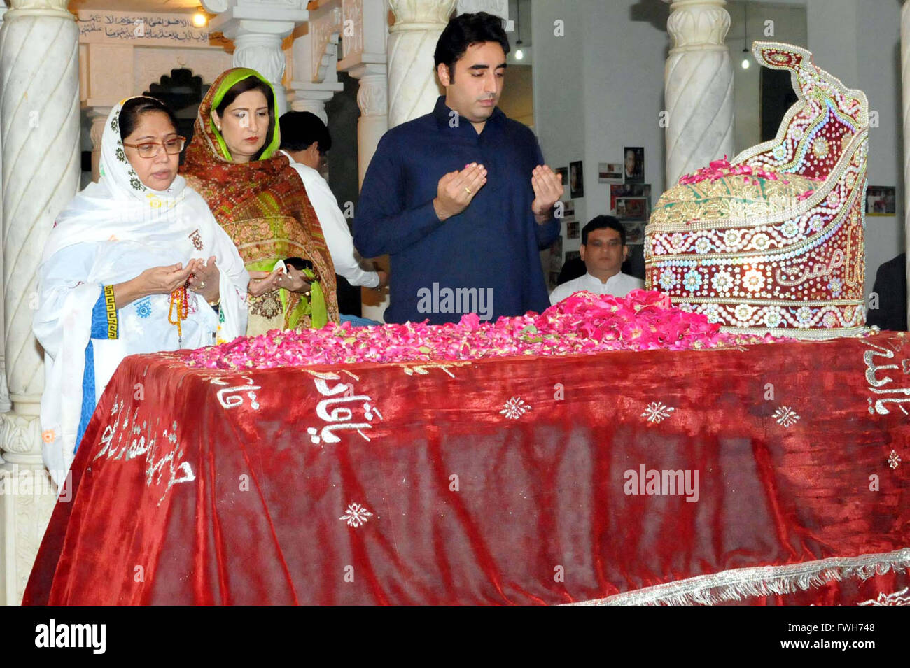 Peoples Party (PPP) Chairman, Bilawal Bhutto Zardari and MNA Faryal Talpur along with other offers Fateha at the grave of Peoples Party (PPP) Founder, Zulfiqar Ali Bhutto, during their visit at his shrine in Garhi Khuda Bux on Tuesday, April 05, 2016. Stock Photo