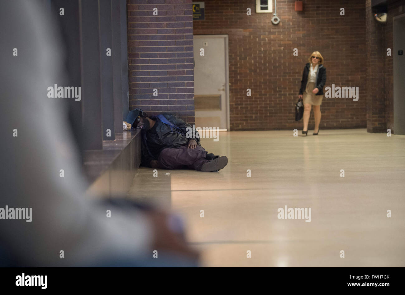 March 22, 2016 - New York, NY, U.S. - An unidentified person sleeps on the floor of Port Authority Bus Terminal, Tuesday, March 22, 2016. (Credit Image: © Bryan Smith via ZUMA Wire) Stock Photo