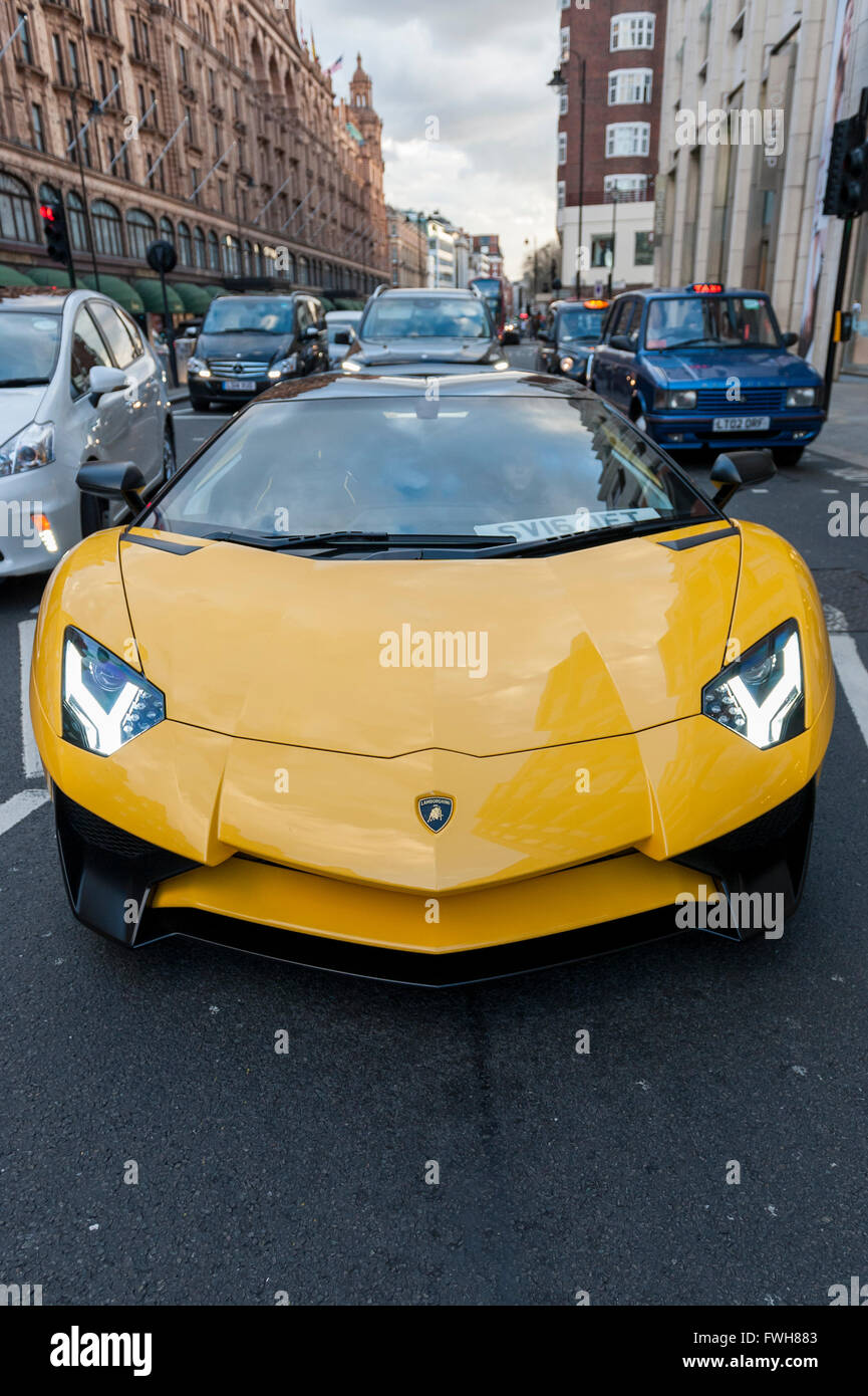 London, UK. 5 April 2016. A bright yellow Aventador SV
