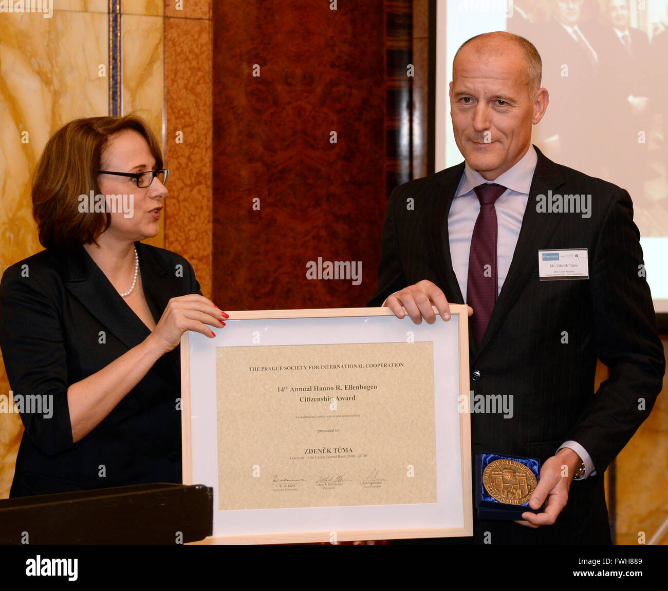 Prague, Czech Republic. 5th April, 2016. Former CNB Czech central bank governor Zdenek Tuma, right, received, from the hands of Mayor of Prague Adriana Krnacova, the Hanno R. Ellenbogen Award for his contribution to civic society in Prague today, on Tuesday, April 5, 2016. The award has been bestowed by the Prague Society for International Cooperation on the personalities who significantly helped develop civic society for the 14th time in a row this year. The Prague Society for International Cooperation was established in 1999 Credit:  CTK/Alamy Live News Stock Photo