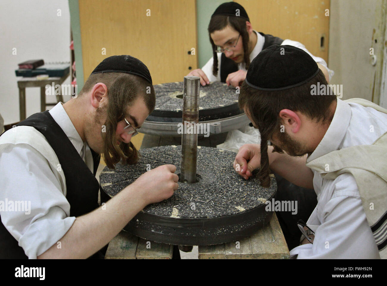 Jerusalem, Jewish holiday of Passover in Jerusalem. 5th Apr, 2016. Ultra-Orthodox Jews collect leftovers of flour for making matzoth (unleavened bread), traditionally eaten for the Jewish holiday of Passover in Jerusalem, on April 5, 2016. Religious Jews throughout the world eat matzoth during the eight-day Pesach holiday (Passover), which begins on April 22, with the sunset to commemorate the Israelis' exodus from Egypt some 3,500 years ago and commemorate their ancestors' plight by refraining from eating leavened food products. © Gil Cohen Magen/Xinhua/Alamy Live News Stock Photo