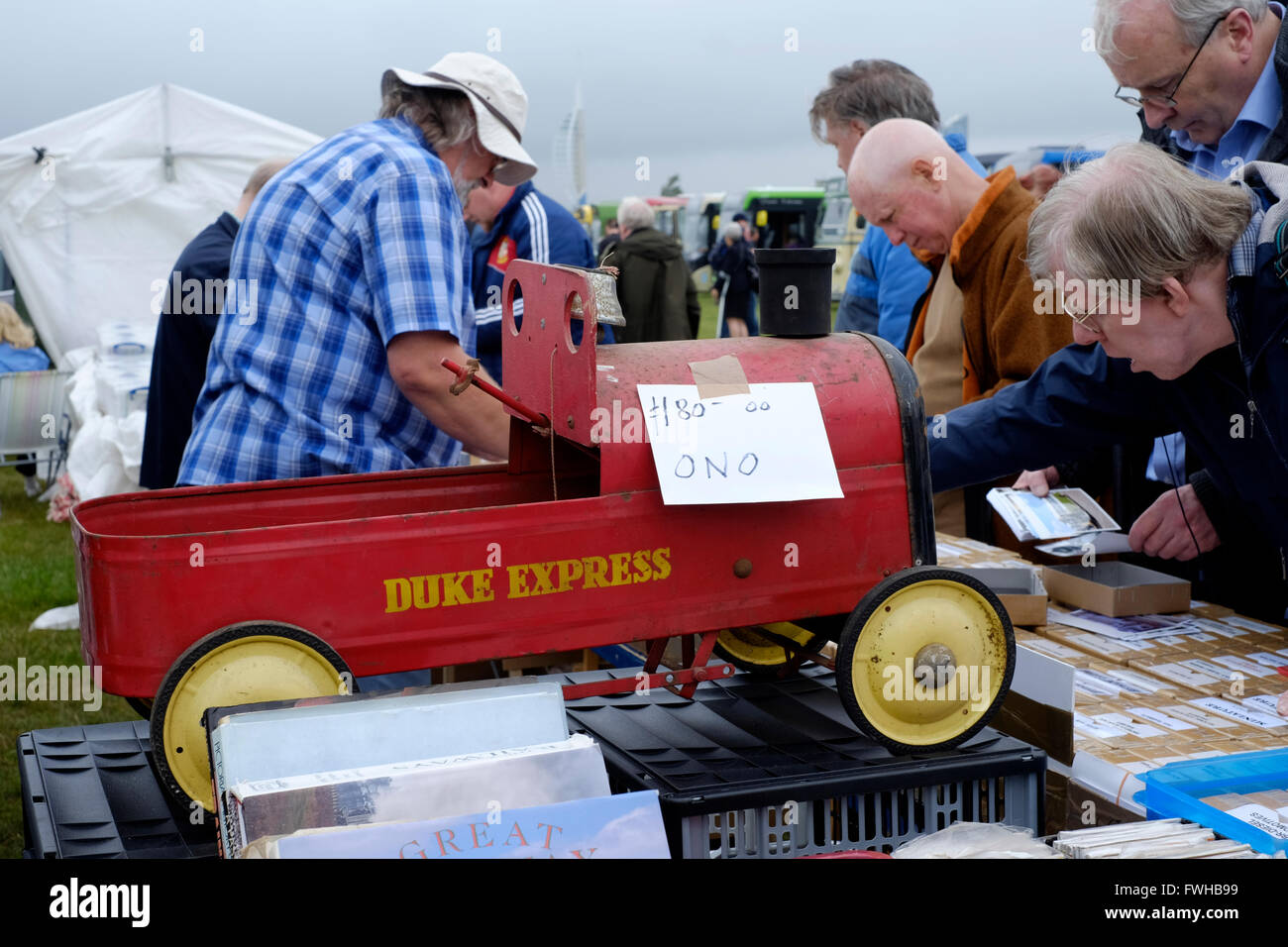 antique metal toy for sale on a collectors stall at a show of classic