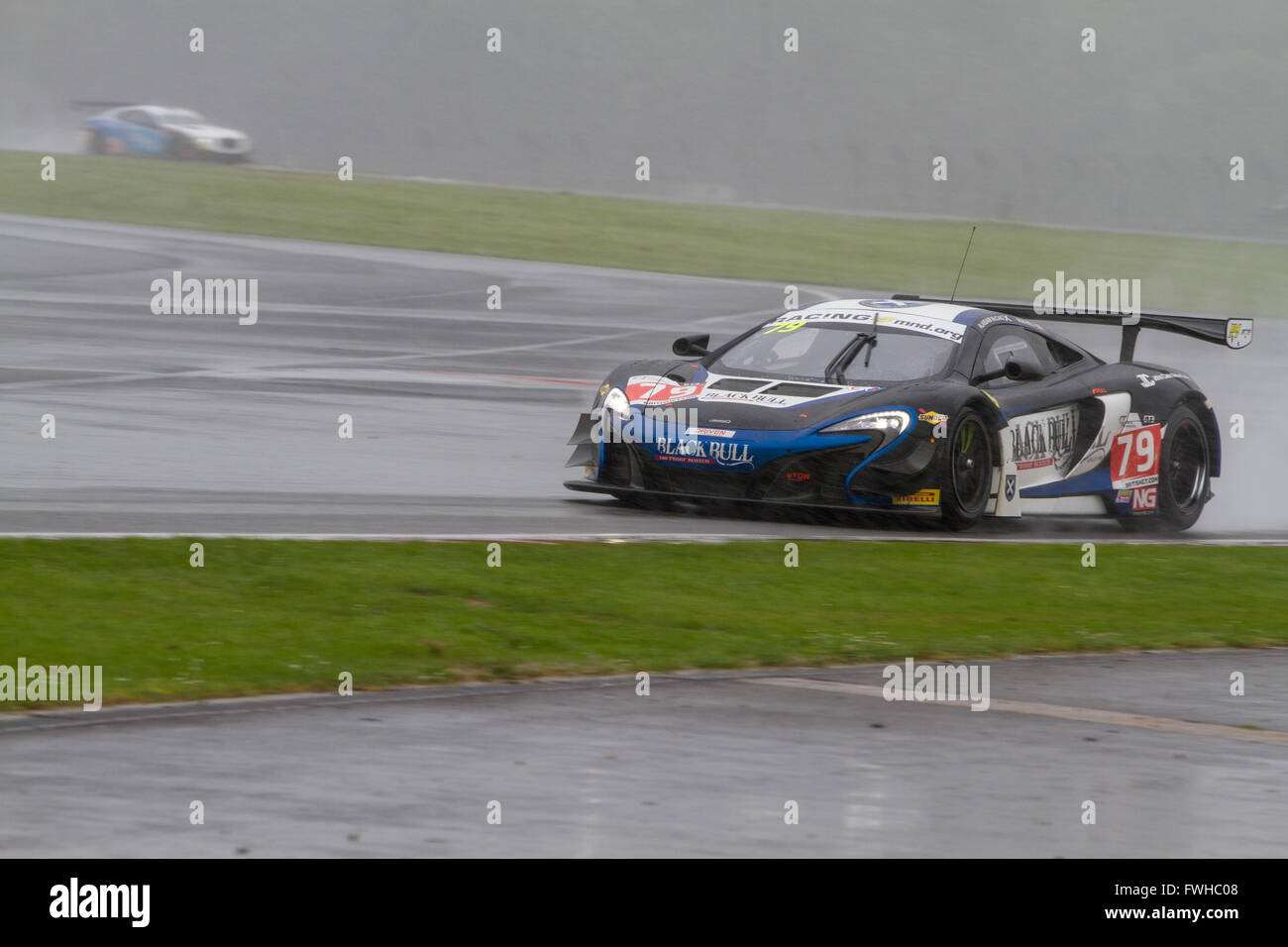 Silverstone, UK. 12th June, 2016. The #79 Black Bull Ecurie Ecosse McLaren 650S GT3 of Alasdair McCaig/Rob Bell heading onto the Hanger straight in tricky weather conditions Credit:  steven roe/Alamy Live News Stock Photo
