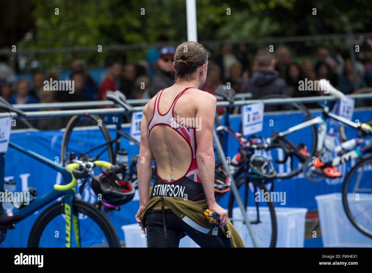 Leeds, UK. 12th June, 2016. Jodie Stimpson GBP Triathlete entering the transition point from swimming to bicycle at Roundhay Park in Leeds Credit:  James Copeland/Alamy Live News Stock Photo
