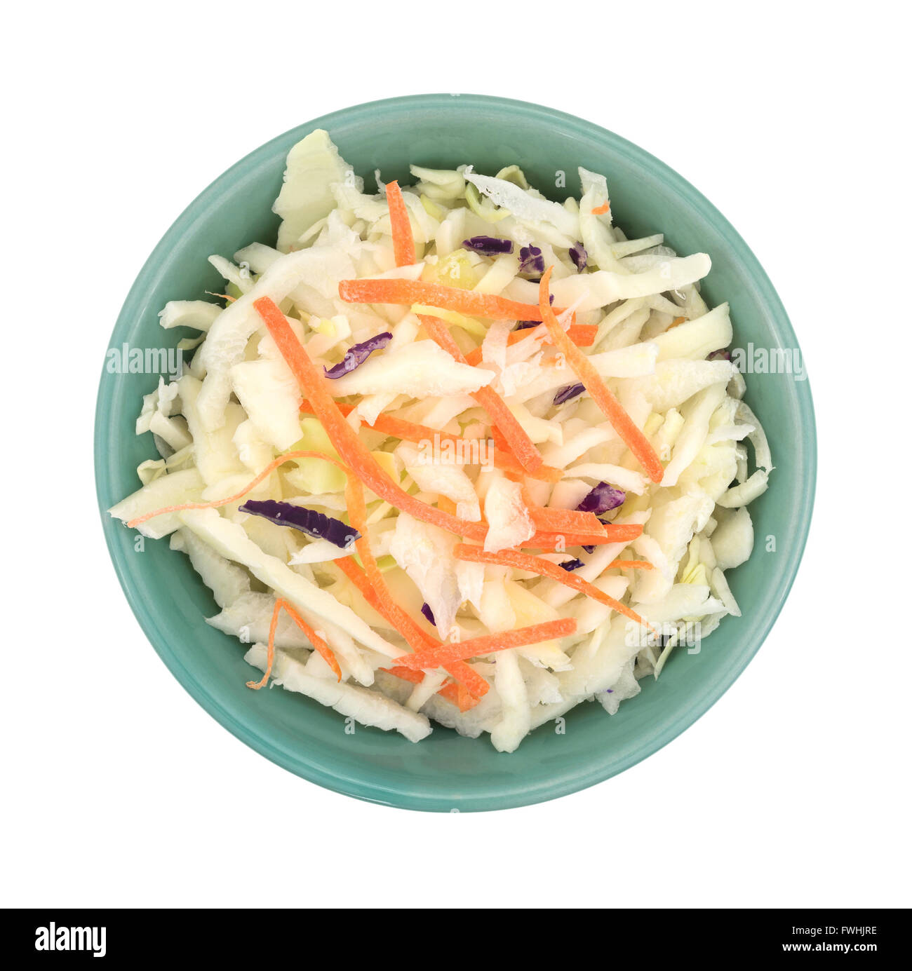 Top view of a bowl filled with coleslaw isolated on a white background. Stock Photo