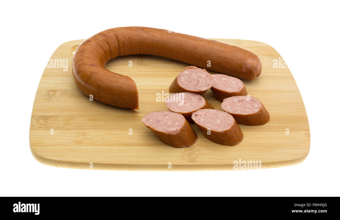 A reduced calorie kielbasa sausage with several slices cut off on a