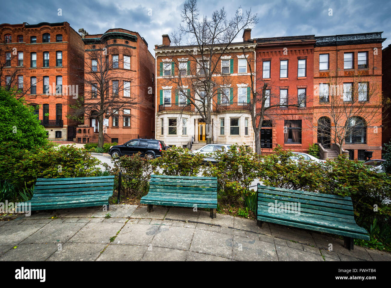 Benches at Park Avenue Median Park and row houses in Bolton Hill
