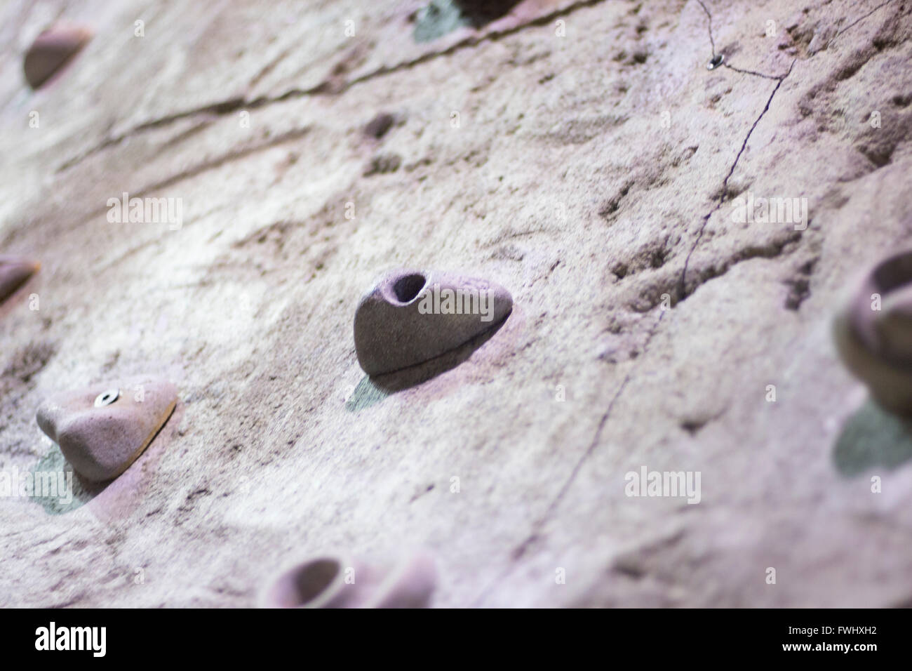 Indoor climbing wall training artificial rock with boulder hand and