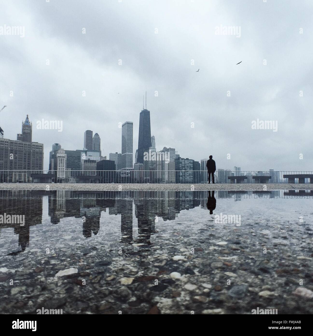 Reflection Of City In Water Stock Photo