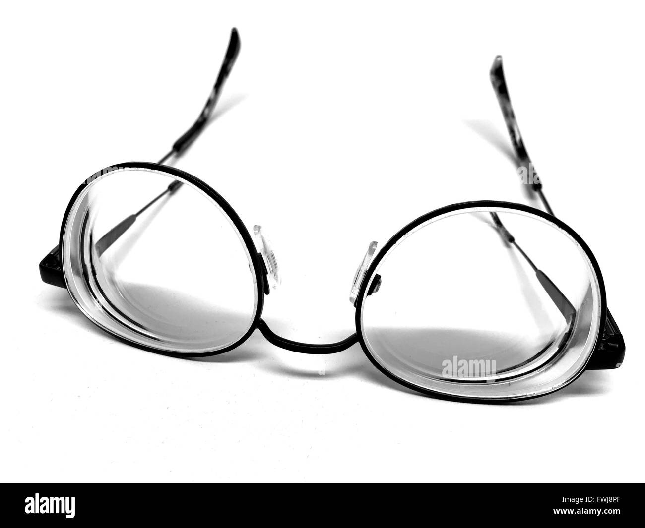 High Angle View Of Eye Glasses Against White Background Stock Photo