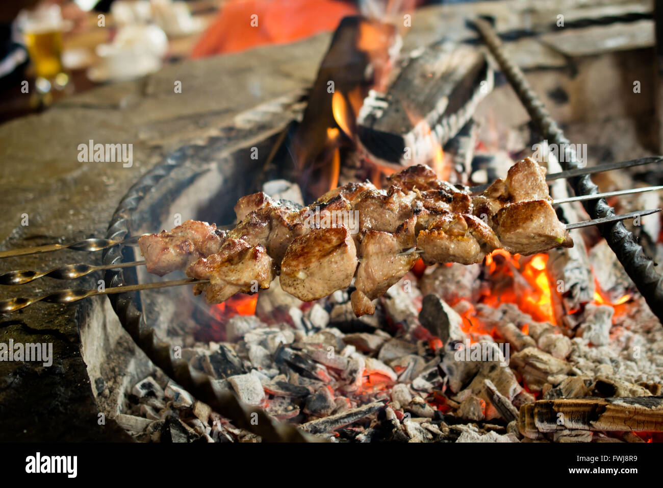 Close-Up Of Meat On Skewer Over Burning Coal Stock Photo