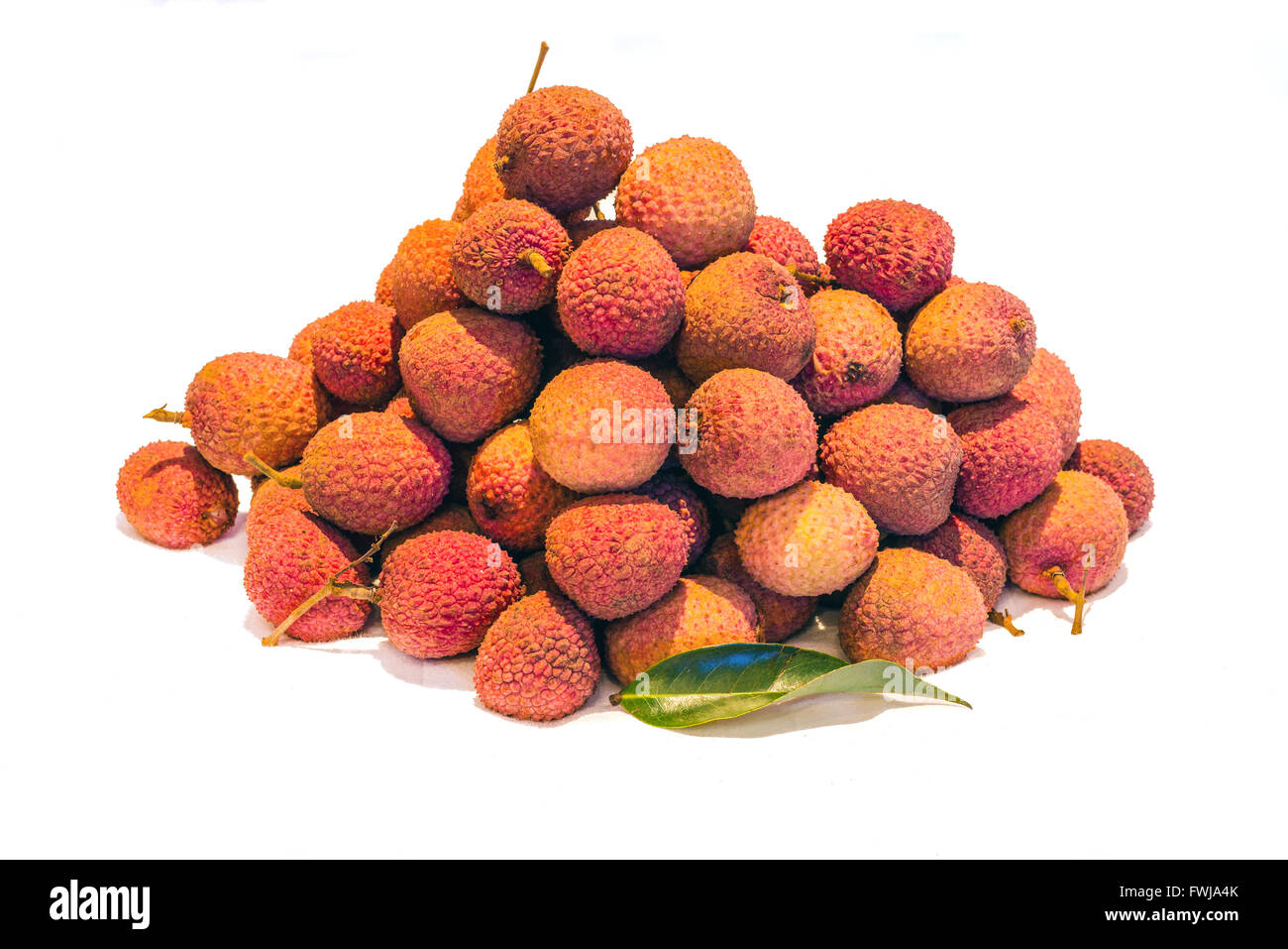 Mound of Lychees (Litchi chinensis) on a white background. Also known as Litchi, Laichi or Lichu. Stock Photo