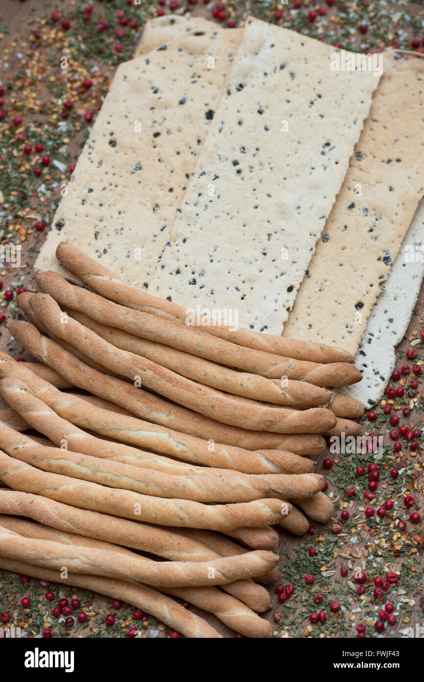 Italian Crispy flatbread / Croccante and Sesame rubato breadsticks on a dried herb and spice