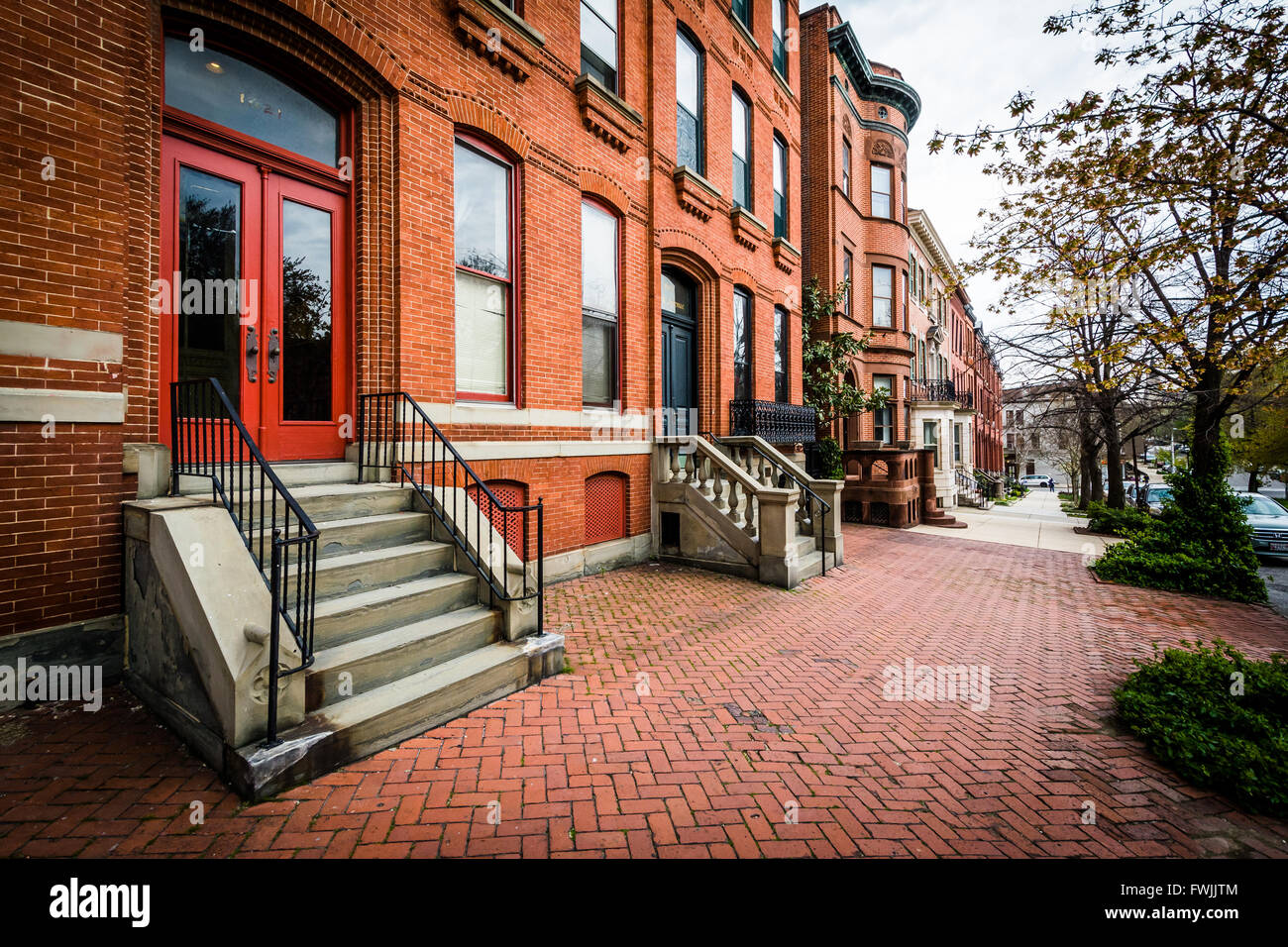 Brick sidewalk and row houses in Bolton Hill, Baltimore, Maryland Stock