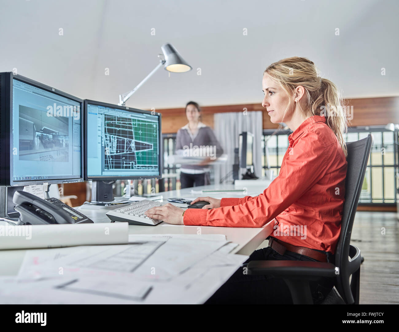 Architect sitting at the computer at work, Austria Stock Photo - Alamy