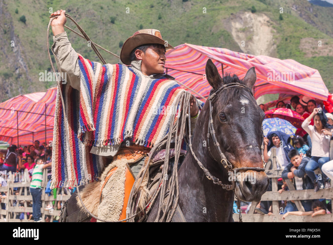 Banos, Ecuador - 30 November 2014: Young Latin Cowboy Riding A Horse, The Most Impressive And Affordable Horse Rides In Ecuador Stock Photo