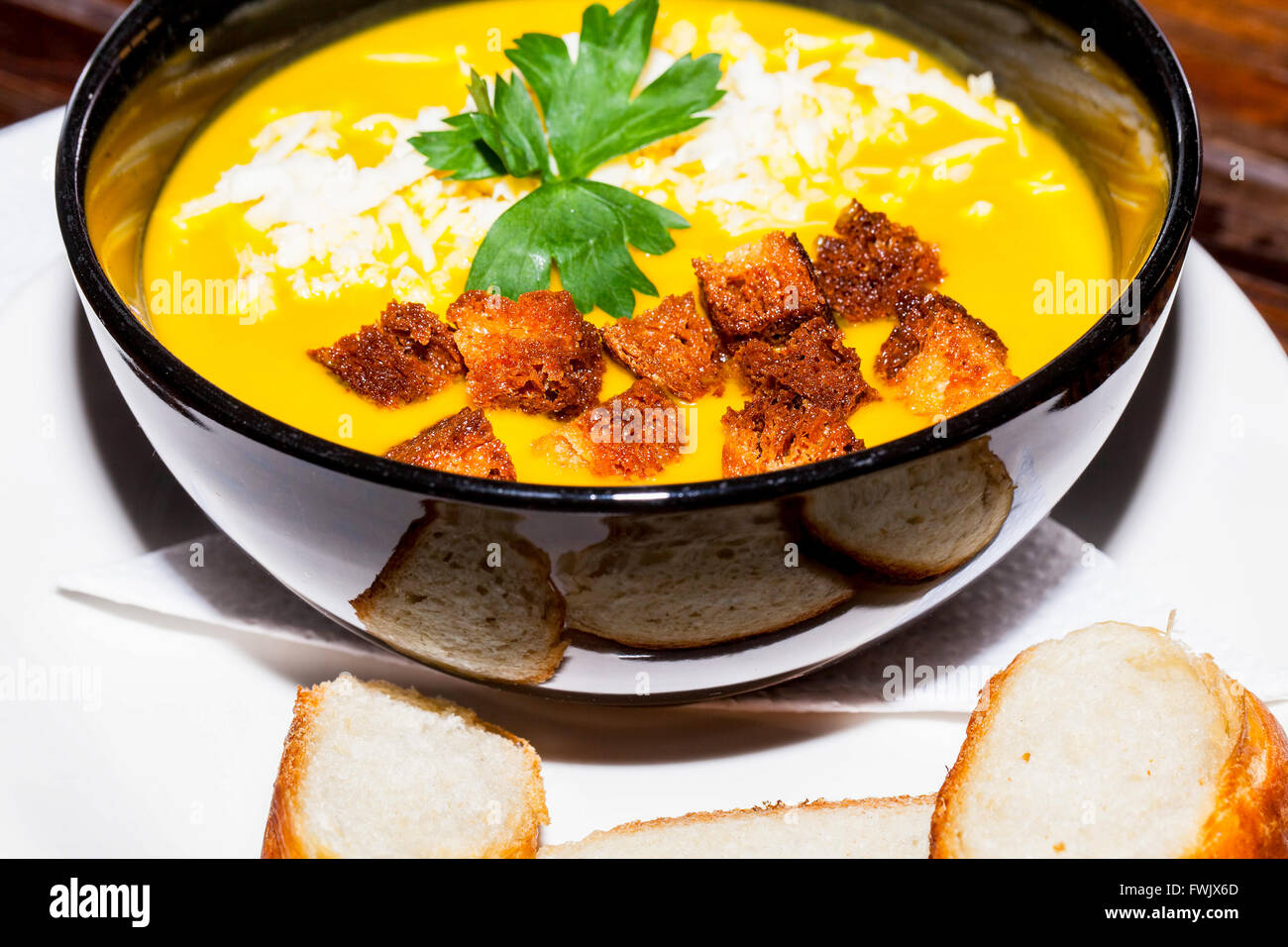 Vegetarian Squash Soup With Parsley, Crouton And Grated Cheese Stock Photo