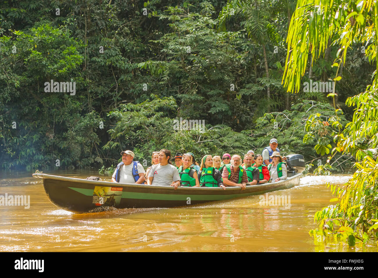 Cuyabeno, Ecuador - 20 March 2015: Young European Biologists In The Canoe Crossing Cuyabeno River, South America In Cuyabeno Stock Photo