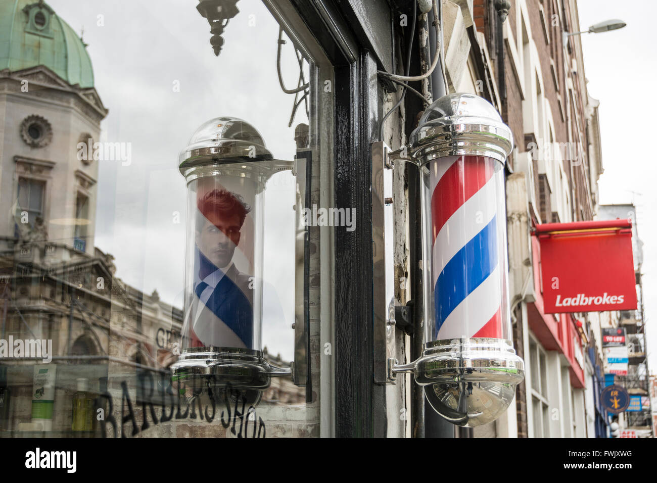 Barbers shops and poles in London's Smithfield area, UK Stock Photo