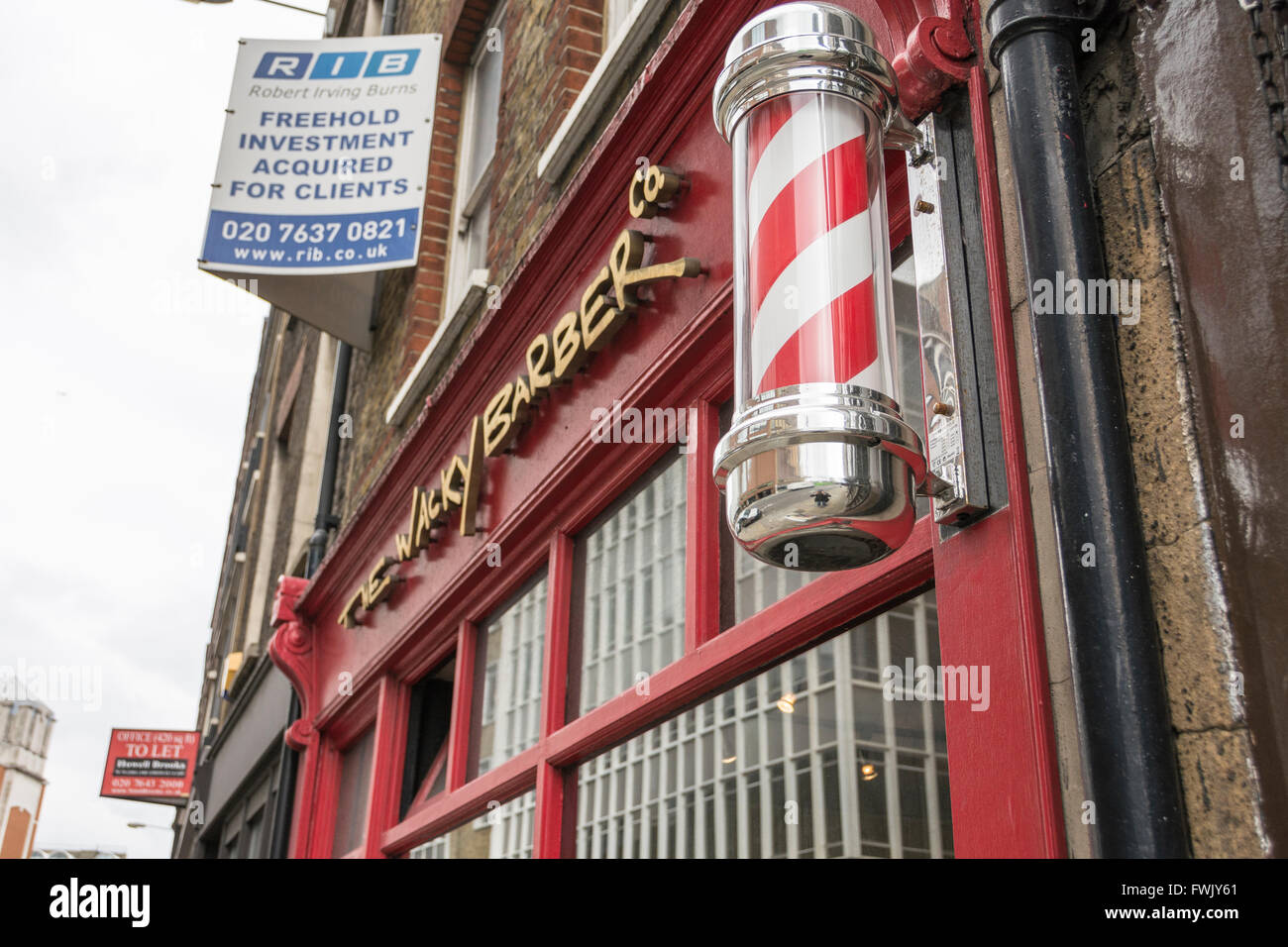 Barbers shops and poles in London's Smithfield area, UK Stock Photo