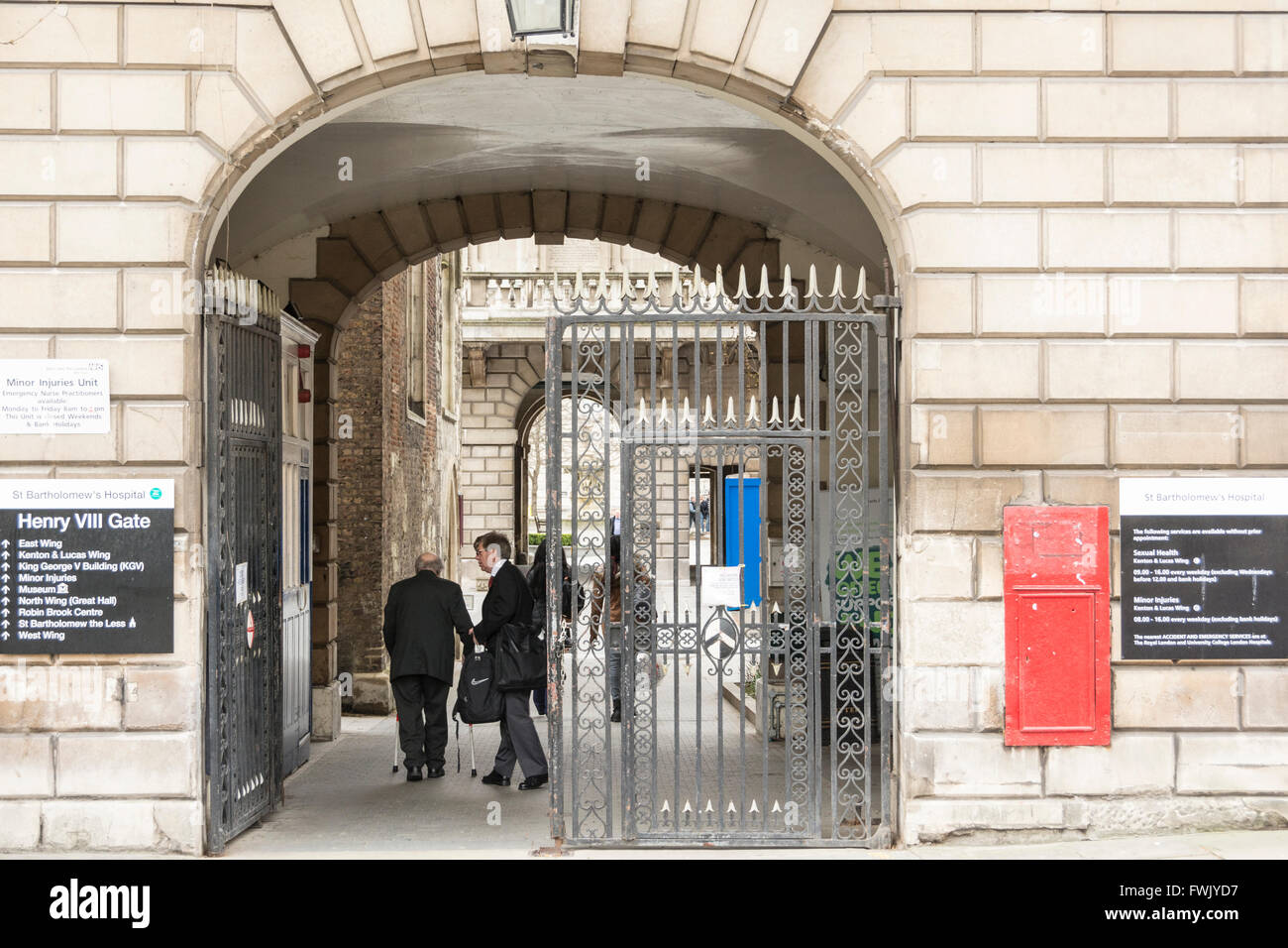 Entrance gate at St. Barts Hospital in Smithfield, central London, UK ...