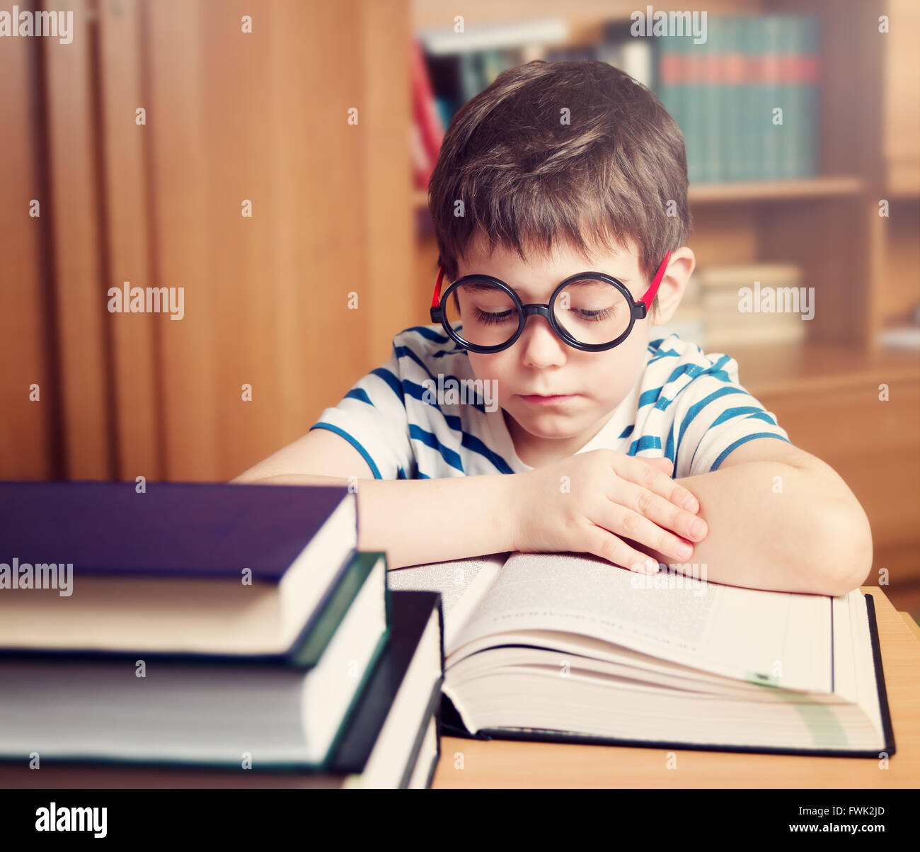 seven years old child reading a book Stock Photo Alamy