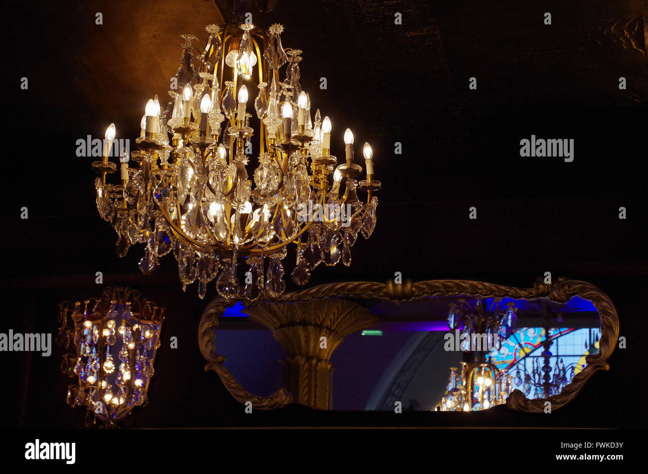 Chandelier of the Casino de Paris reflecting in several mirrors Stock Photo
