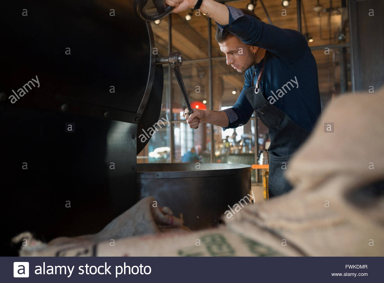 Coffee Roaster Using Coffee Roasting Machine Stock Photo Alamy