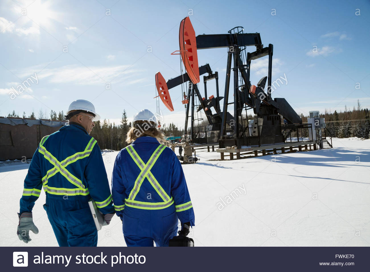 Drilling rig worker in hard hat workwear hires stock photography and