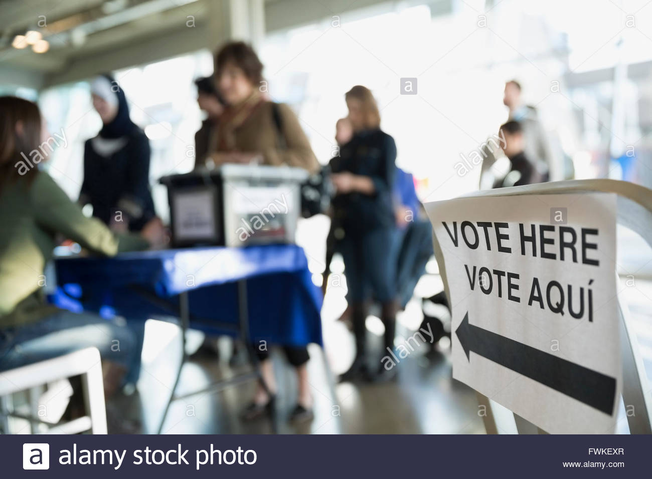 'Vote here' sign at polling place Stock Photo