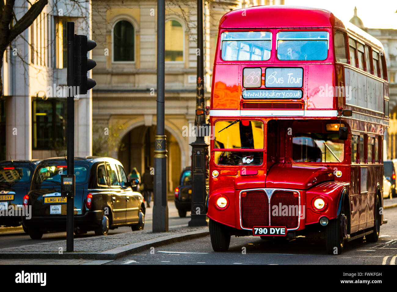 Traditional London Routemaster Red Bus and Black cab near Trafalgar square Stock Photo