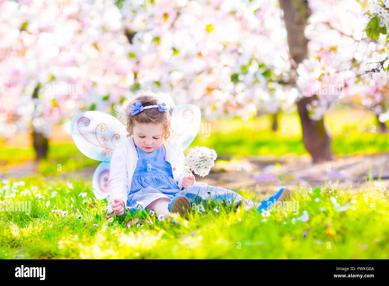 Adorable Toddler Girl With Curly Hair And Flower Crown Wearing A