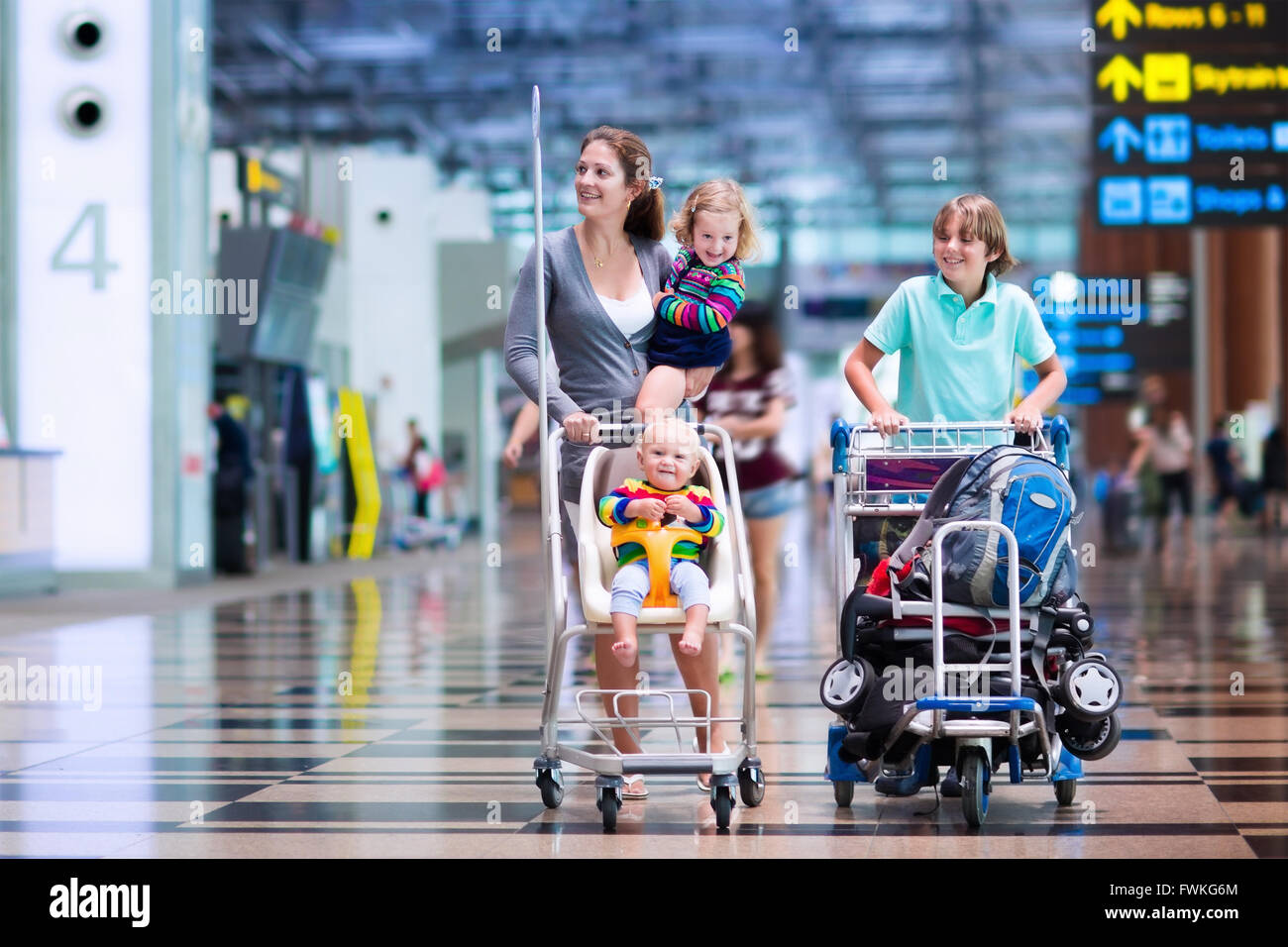 Family traveling with kids. Parents with children at international