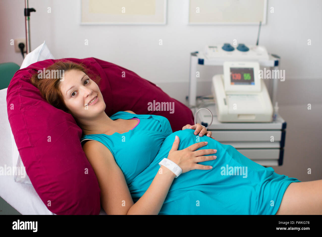 Mother giving birth to baby. Pregnant patient in a hospital at doctor