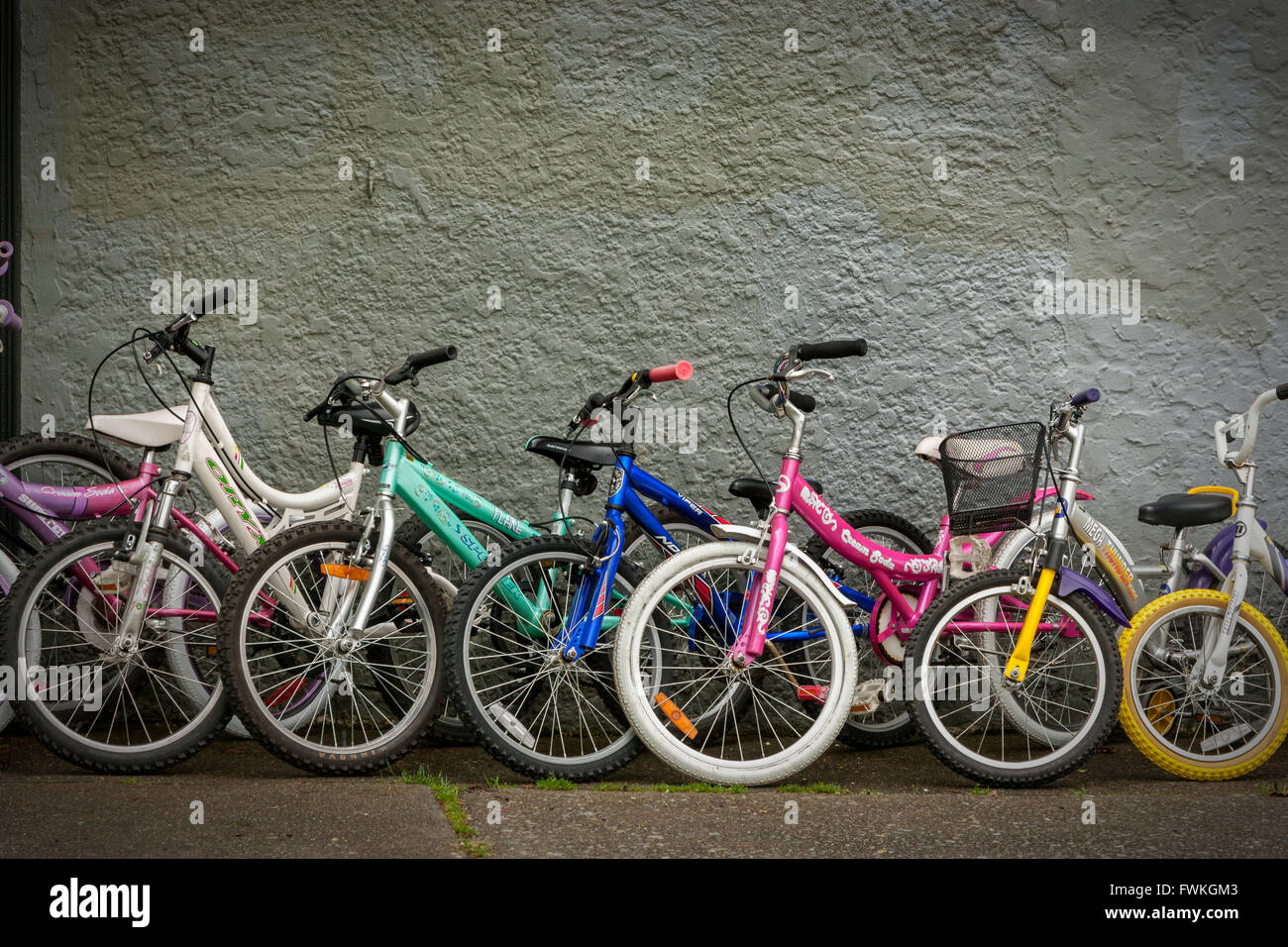 Row of Children's bicycles outside of bicycle shop-Victoria, British Columbia, Canada. Stock Photo