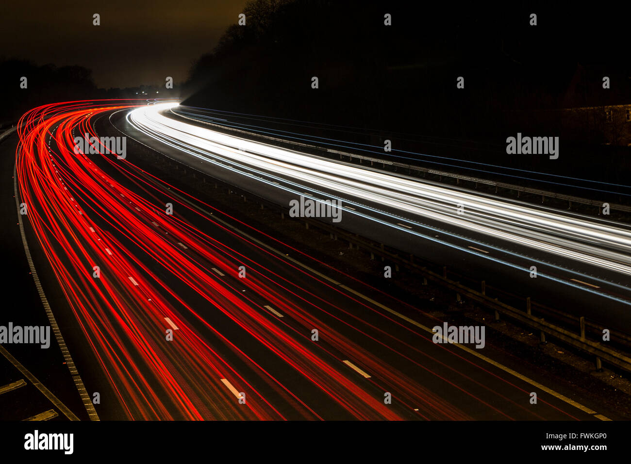 Night view from a bridge of light trails from traffic on the M4 motorway Stock Photo