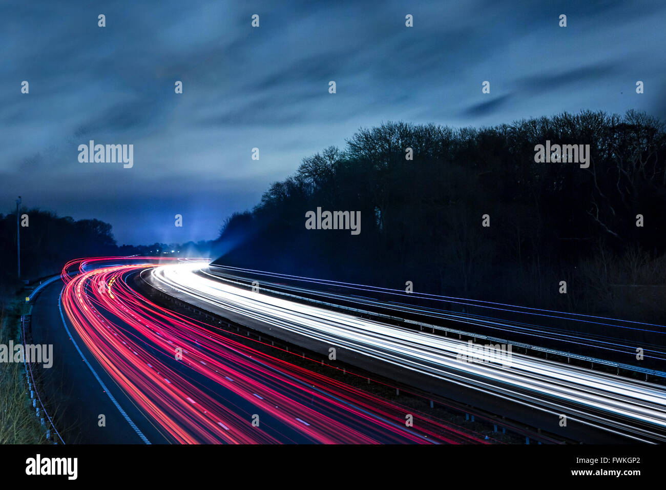 Night view from a bridge of light trails from traffic on the M4 motorway Stock Photo