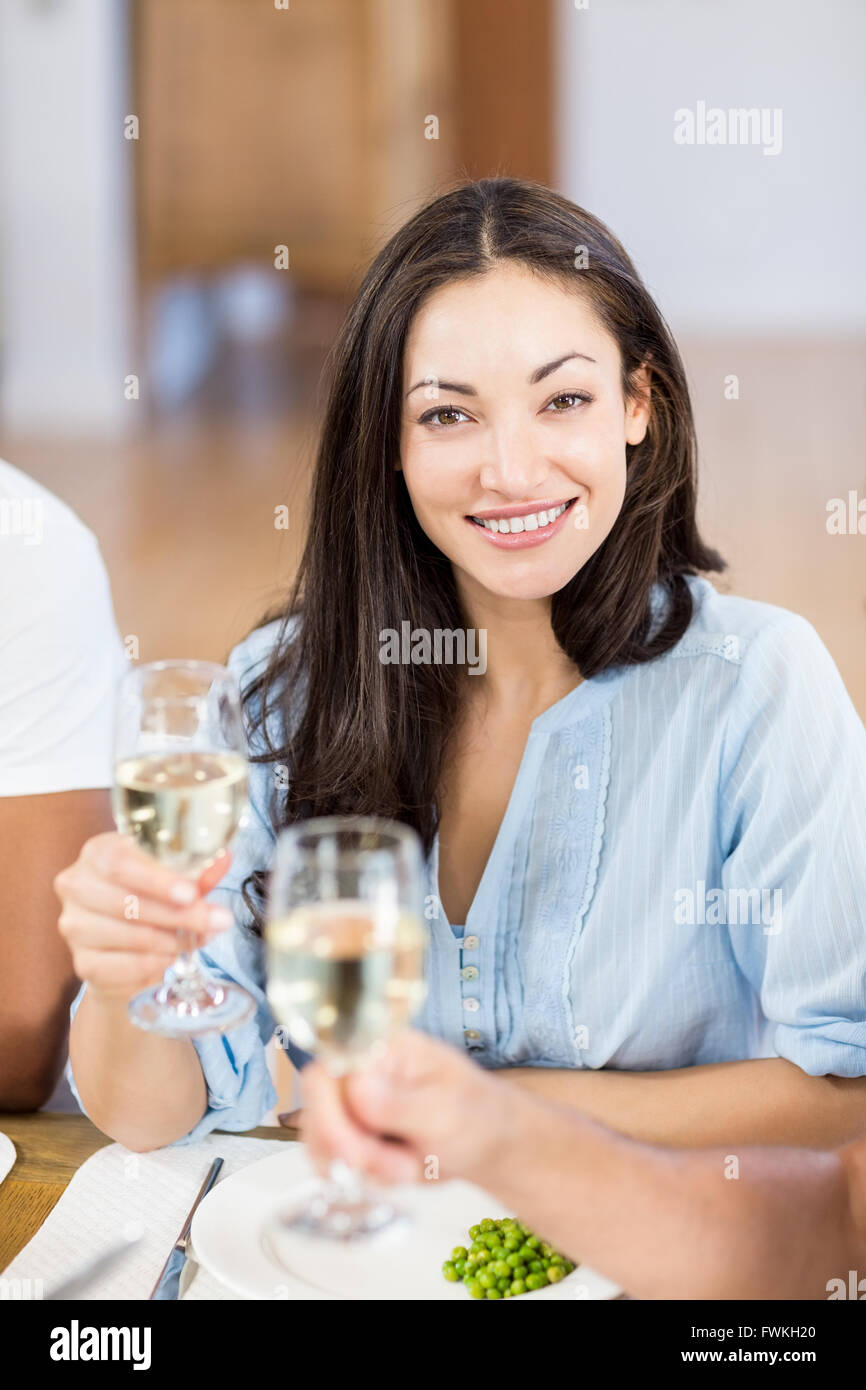 Young woman holding a glass of wine Stock Photo - Alamy