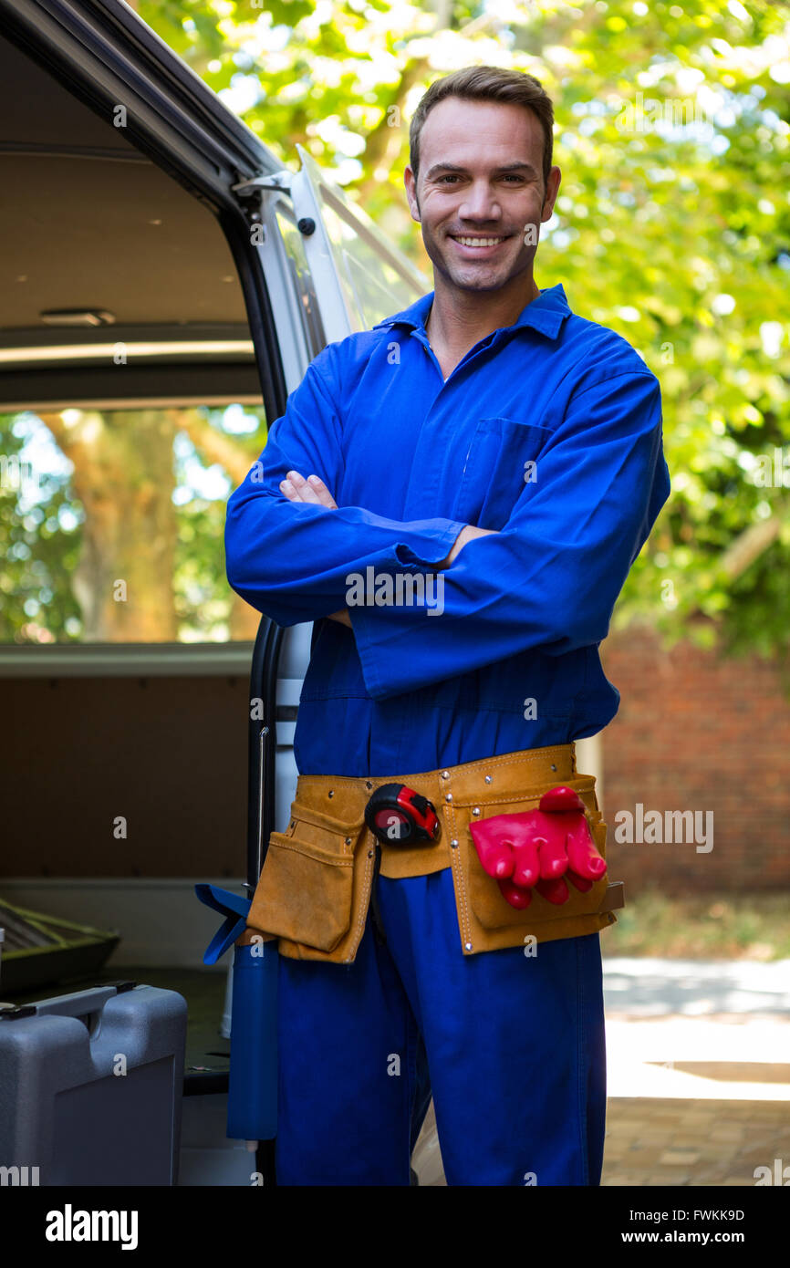 Mechanic with a tool belt around waist Stock Photo Alamy