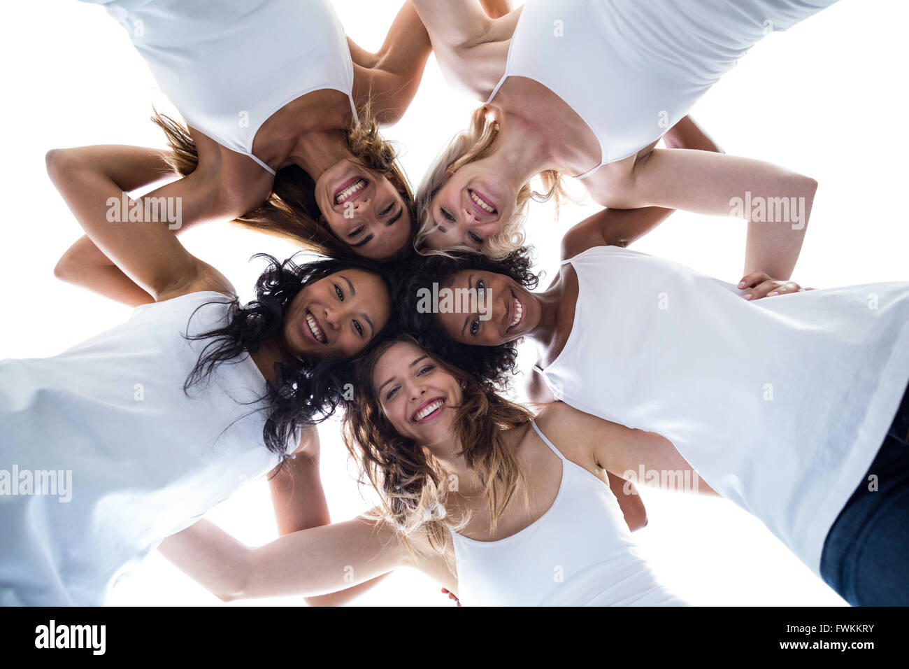 Happy women forming a huddle Stock Photo