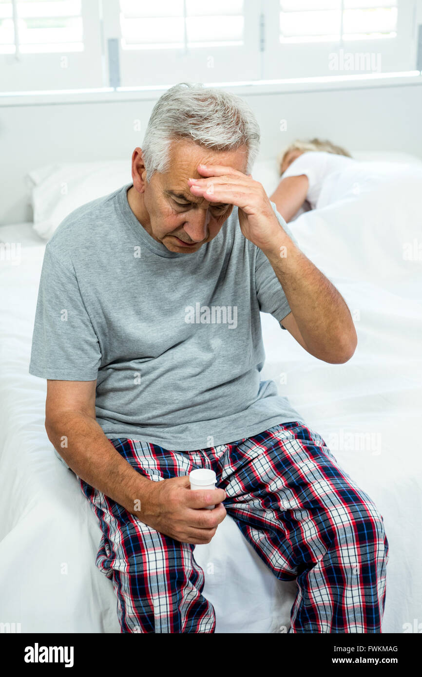 Senior man suffering from headache Stock Photo - Alamy