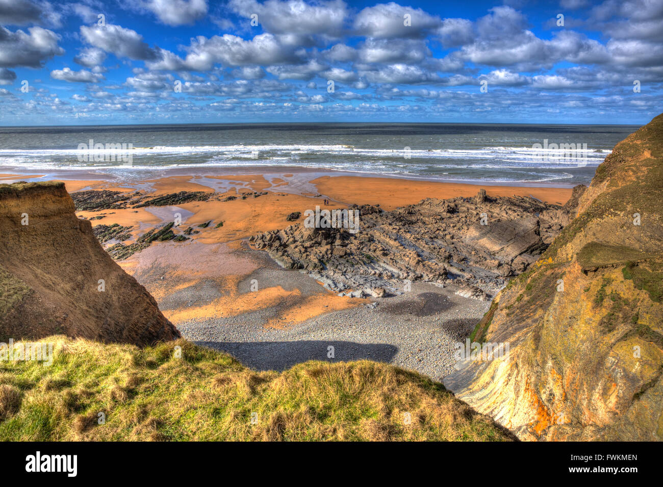 View of Sandymouth beach North Cornwall England UK with cloudscape near Bude in hdr Stock Photo